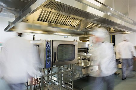 Team of chefs working in a commercial kitchen at a hurried pace Stock Photo - Budget Royalty-Free & Subscription, Code: 400-07139954