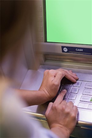 simsearch:400-05670020,k - Woman entering pin and covering keyboard at an ATM Stock Photo - Budget Royalty-Free & Subscription, Code: 400-07142149