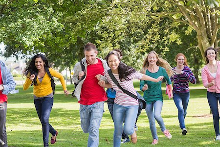 Full length of a group of college students running in the park Stock Photo - Budget Royalty-Free & Subscription, Code: 400-07142657