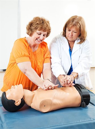 simsearch:400-07411030,k - Doctor teaches adult education student how to perform CPR. Stock Photo - Budget Royalty-Free & Subscription, Code: 400-07165100