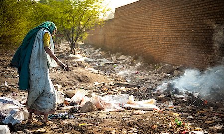 rubber plant - Pollution and poverty : Indian old female sitting  for warmup  herself near fire  in  garbage, Stock Photo - Budget Royalty-Free & Subscription, Code: 400-07165170