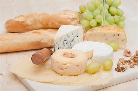 different types of bread pictures - Various Types of Cheese and Grapes on Wooden Chopping Board Stock Photo - Budget Royalty-Free & Subscription, Code: 400-07166247