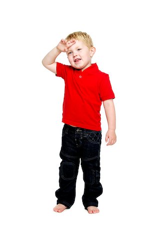 Young boy wearing jeans and a red T-shirt stood isolated on a white background wiping his brow Stock Photo - Budget Royalty-Free & Subscription, Code: 400-07166433