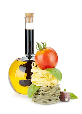 simsearch:400-06796273,k - Italian food: pasta, tomatoes, olive oil. Isolated on white background Stock Photo - Budget Royalty-Free & Subscription, Code: 400-07166505