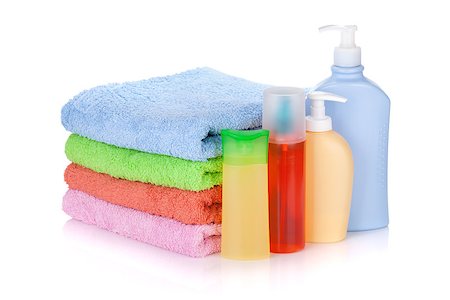 simsearch:400-05370670,k - Cosmetics bottles and towels. Isolated on white background Stock Photo - Budget Royalty-Free & Subscription, Code: 400-07166566
