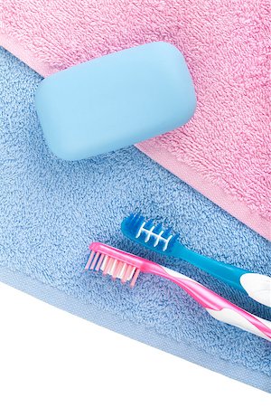 simsearch:400-05370670,k - Toothbrushes and soap over towel. View from above Stock Photo - Budget Royalty-Free & Subscription, Code: 400-07166594