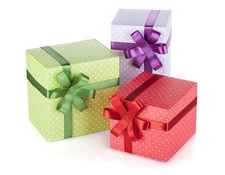 simsearch:400-08806797,k - Three colorful gift boxes with ribbon and bow. Isolated on white background Photographie de stock - Aubaine LD & Abonnement, Code: 400-07166609