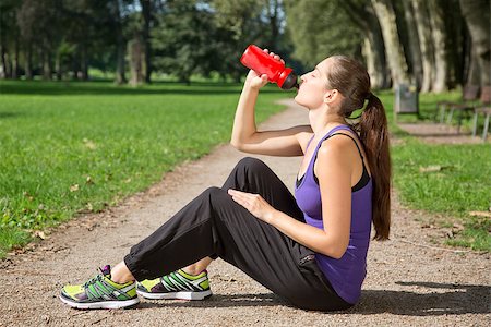 simsearch:400-04969467,k - Young woman takes a break for drinking water after sports or running Photographie de stock - Aubaine LD & Abonnement, Code: 400-07169086