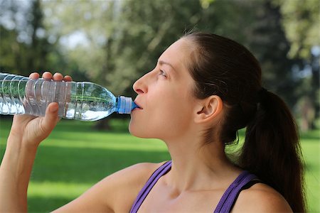 simsearch:400-04969467,k - Young woman drinking water from a bottle after sports or running Photographie de stock - Aubaine LD & Abonnement, Code: 400-07169083
