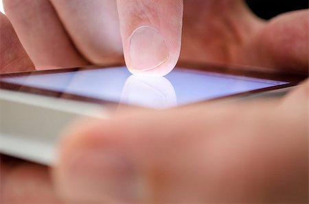 simsearch:400-06632132,k - Close up of a man using touch screen device. Stock Photo - Budget Royalty-Free & Subscription, Code: 400-07169868