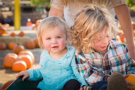 farmers market family - Adorable Young Family Enjoys a Day at the Pumpkin Patch. Stock Photo - Budget Royalty-Free & Subscription, Code: 400-07174839