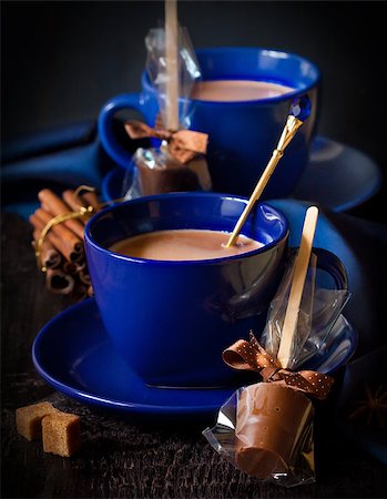 simsearch:700-03698239,k - Delicious hot chocolate in a blue cups with chocolate candy and spices on a dark background. Stock Photo - Budget Royalty-Free & Subscription, Code: 400-07175503
