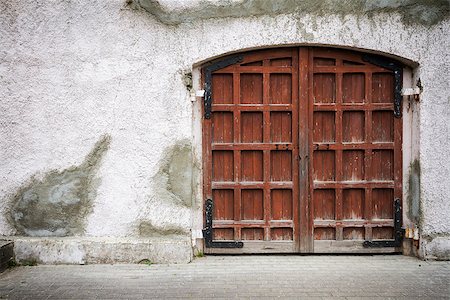 simsearch:400-07217858,k - Old wooden gate in grungy gray wall Stock Photo - Budget Royalty-Free & Subscription, Code: 400-07176668