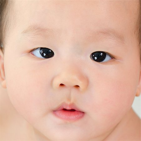 simsearch:400-06389659,k - Close up face of Asian baby boy with curious look Foto de stock - Super Valor sin royalties y Suscripción, Código: 400-07171469