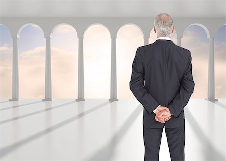 simsearch:400-04283915,k - Composite image of rear view of serious mature businessman posing in bright white room with windows Stock Photo - Budget Royalty-Free & Subscription, Code: 400-07180266