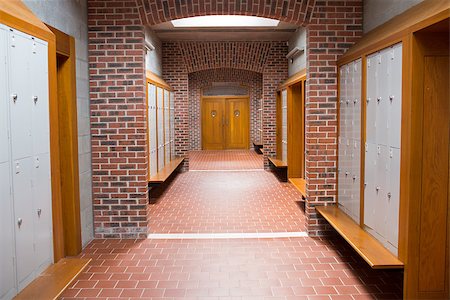 View of an empty brick walled corridor with tiled flooring in college Stock Photo - Budget Royalty-Free & Subscription, Code: 400-07180852