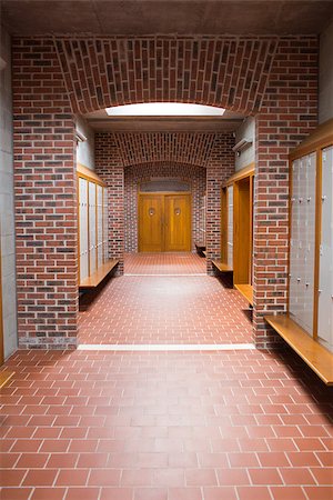 View of an empty brick walled corridor with tiled flooring in college Stock Photo - Budget Royalty-Free & Subscription, Code: 400-07180853