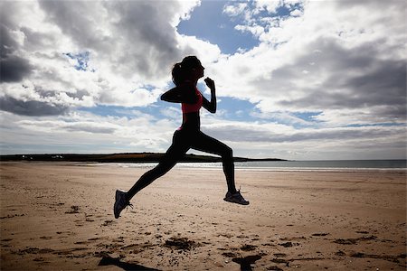simsearch:400-07181052,k - Full length of a silhouette healthy young woman jogging on shore at beach Stock Photo - Budget Royalty-Free & Subscription, Code: 400-07180895
