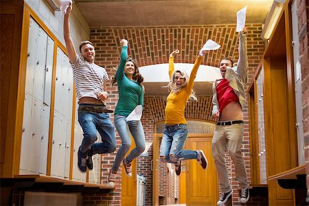 simsearch:400-07181052,k - Full length of a group of students jumping in college corridor Stock Photo - Budget Royalty-Free & Subscription, Code: 400-07180890