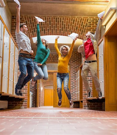 simsearch:400-07181052,k - Full length of a group of students jumping in college corridor Stock Photo - Budget Royalty-Free & Subscription, Code: 400-07180891