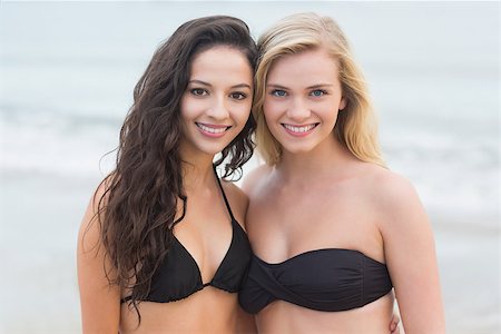 simsearch:400-07181052,k - Portrait of two smiling young bikini women at the beach Stock Photo - Budget Royalty-Free & Subscription, Code: 400-07181062