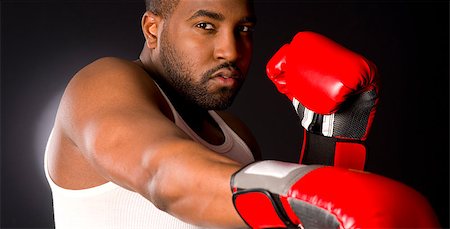defensive posture - A boxer punches at you in red gloves Stock Photo - Budget Royalty-Free & Subscription, Code: 400-07208635