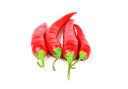 paprika - Four fresh juicy red peppers on a white background Stock Photo - Budget Royalty-Free & Subscription, Code: 400-07209860