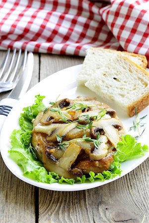 simsearch:649-06352937,k - pork steak with mushroom sauce on a plate Stock Photo - Budget Royalty-Free & Subscription, Code: 400-07215176