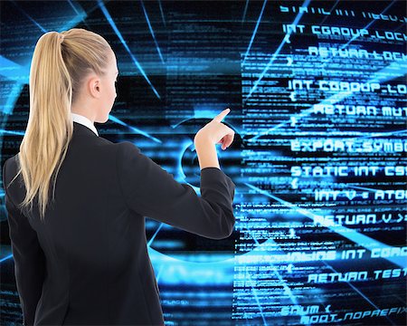 programming - Composite image of blonde businesswoman pointing somewhere Stock Photo - Budget Royalty-Free & Subscription, Code: 400-07219984