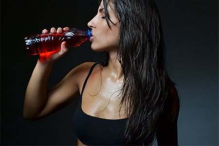 simsearch:400-05115517,k - beautiful woman drinking energy drink, studio shot Stock Photo - Budget Royalty-Free & Subscription, Code: 400-07211507