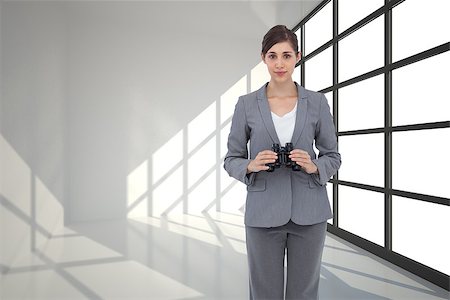 Composite image of young businesswoman with binoculars Stock Photo - Budget Royalty-Free & Subscription, Code: 400-07225948