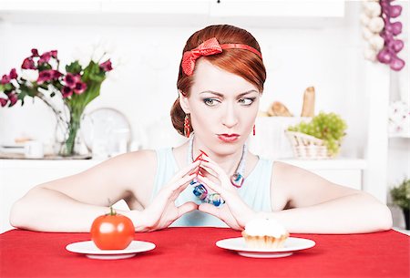 simsearch:400-05106591,k - Beautiful woman choosing between healthy food and cake Stock Photo - Budget Royalty-Free & Subscription, Code: 400-07244209