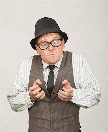 Single upset businessman with eyeglasses clenching fists Stock Photo - Budget Royalty-Free & Subscription, Code: 400-07247179
