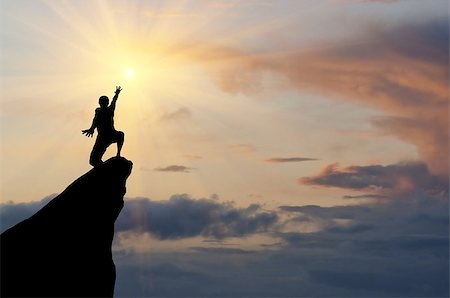 simsearch:400-05382140,k - man on top of the mountain reaches for the sun Stock Photo - Budget Royalty-Free & Subscription, Code: 400-07248706