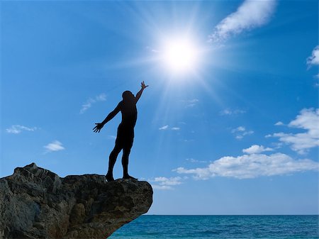 simsearch:400-05382140,k - man on top of the mountain reaches for the sun Stock Photo - Budget Royalty-Free & Subscription, Code: 400-07248702