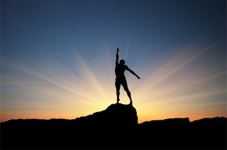 simsearch:400-05382140,k - man on top of the mountain reaches for the sun Stock Photo - Budget Royalty-Free & Subscription, Code: 400-07248745