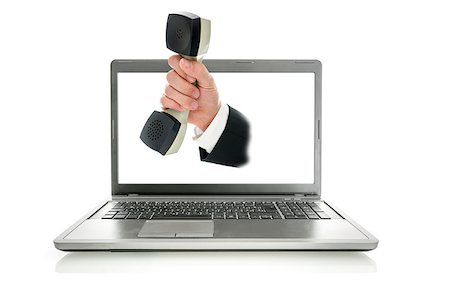 Male hand coming out of laptop monitor offering you telephone handset. Online customer service concept. Stock Photo - Budget Royalty-Free & Subscription, Code: 400-07249750