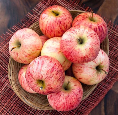 simsearch:400-07096505,k - Fresh red apples in basket on the wooden table, top view Stock Photo - Budget Royalty-Free & Subscription, Code: 400-07249854