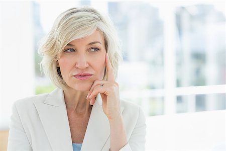 simsearch:400-04283915,k - Closeup of a mature businesswoman looking away in a bright office Stock Photo - Budget Royalty-Free & Subscription, Code: 400-07274448