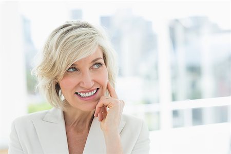 simsearch:400-04283915,k - Closeup of a mature businesswoman looking away in a bright office Stock Photo - Budget Royalty-Free & Subscription, Code: 400-07274449