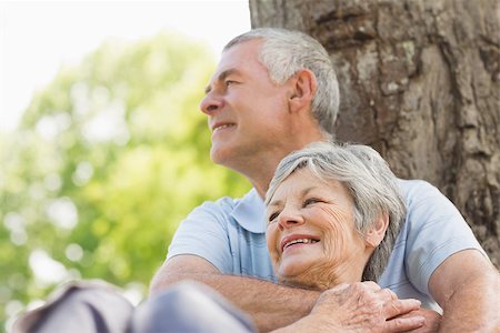 simsearch:649-07239704,k - Portrait of a happy senior man embracing woman from behind at the park Stock Photo - Budget Royalty-Free & Subscription, Code: 400-07275056