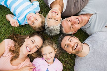 High angle portrait of an extended family lying in circle at the park Stock Photo - Budget Royalty-Free & Subscription, Code: 400-07275096