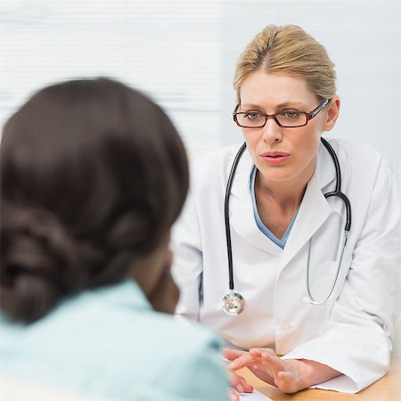 doctor with ethnic patient in office - Concerned doctor talking to her patient in an office at the hospital Stock Photo - Budget Royalty-Free & Subscription, Code: 400-07275618