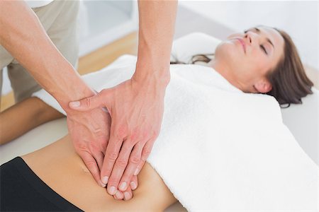 simsearch:400-05352116,k - Close-up of a physiotherapist massaging woman's body in the medical office Photographie de stock - Aubaine LD & Abonnement, Code: 400-07271251