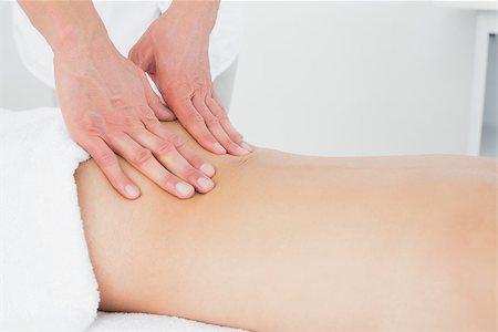 simsearch:400-05352116,k - Close-up of a male physiotherapist massaging woman's back in the medical office Photographie de stock - Aubaine LD & Abonnement, Code: 400-07271422