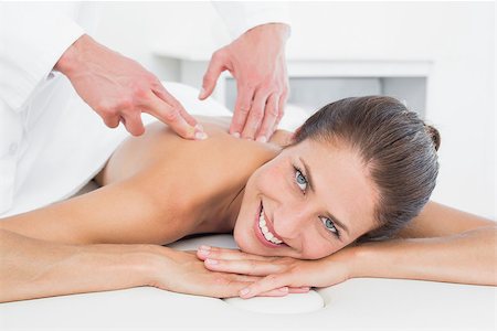 simsearch:400-05352116,k - Male physiotherapist massaging woman's back in the medical office Photographie de stock - Aubaine LD & Abonnement, Code: 400-07271441