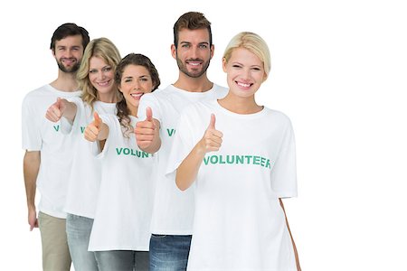 Group portrait of happy volunteers gesturing thumbs up over white background Foto de stock - Super Valor sin royalties y Suscripción, Código: 400-07273309