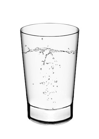 dehydrated - A glass of water and water splahes on white background Foto de stock - Super Valor sin royalties y Suscripción, Código: 400-07288541