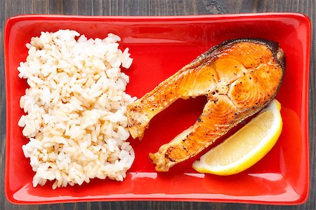 Fried salmon with rice on a red plate Stock Photo - Budget Royalty-Free & Subscription, Code: 400-07295484