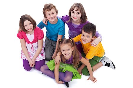 Group of kids sitting on the floor holding to each other - isolated Stock Photo - Budget Royalty-Free & Subscription, Code: 400-07297820